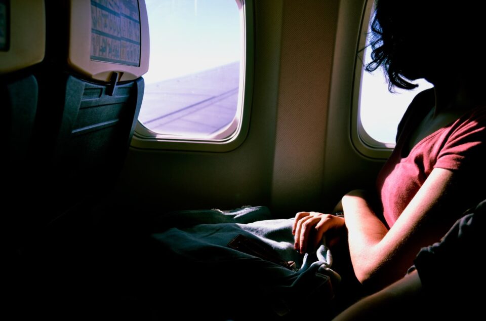 Looking out the window of an airplane. Photo by Sofia Sforza on Unsplash