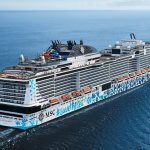 Aerial view of the MSC Euribia cruise ship, featuring its distinctive blue hull art and onboard waterpark