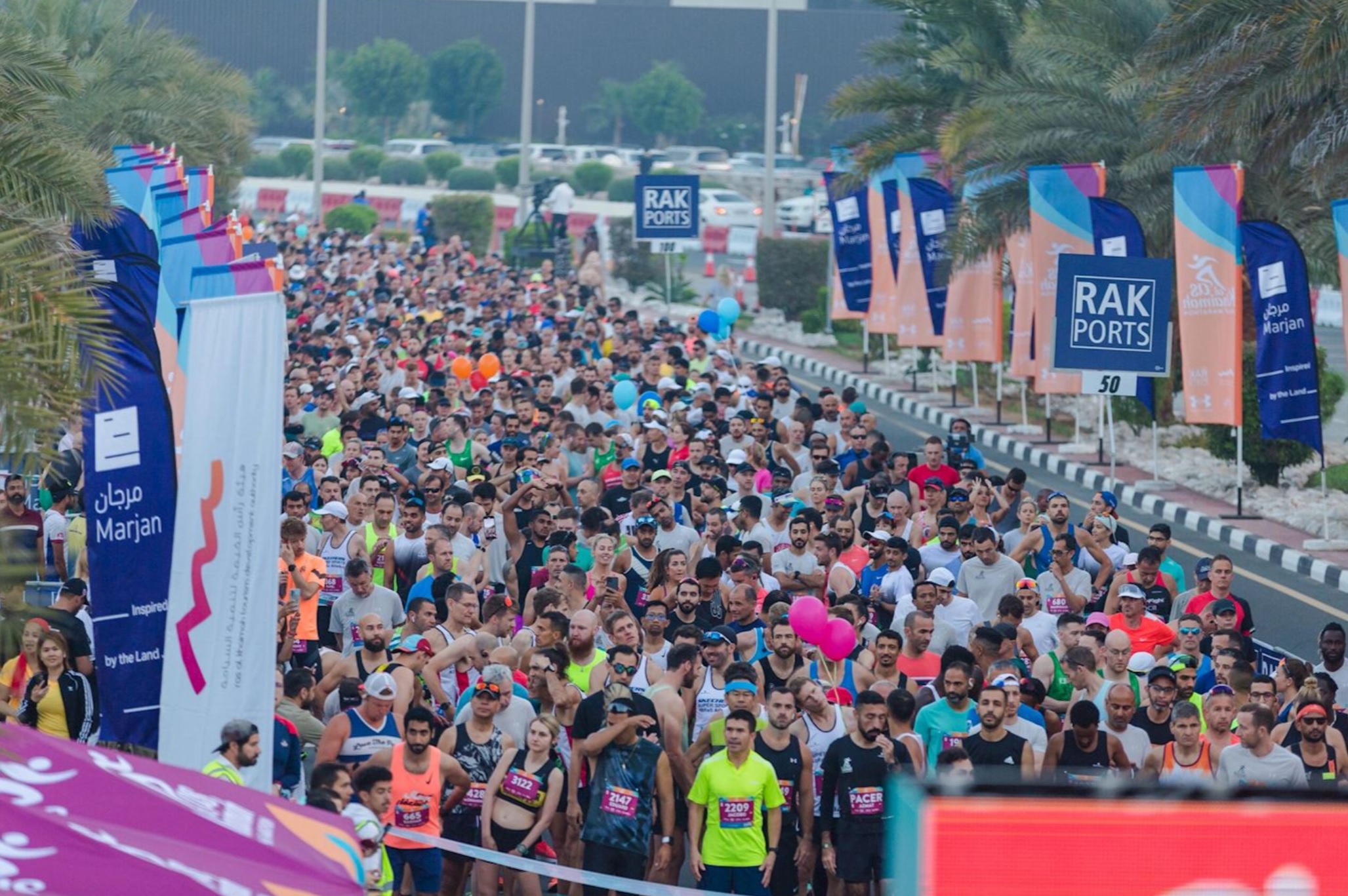 Large crowd of runners at the start line of the Ras Al Khaimah Half Marathon