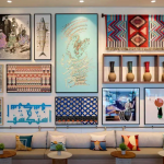 Rove hotel lobby with colourful Middle Eastern art wall and patterned cushions